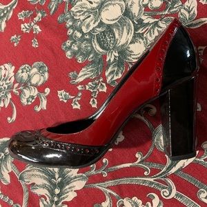Red and black patent leather pumps